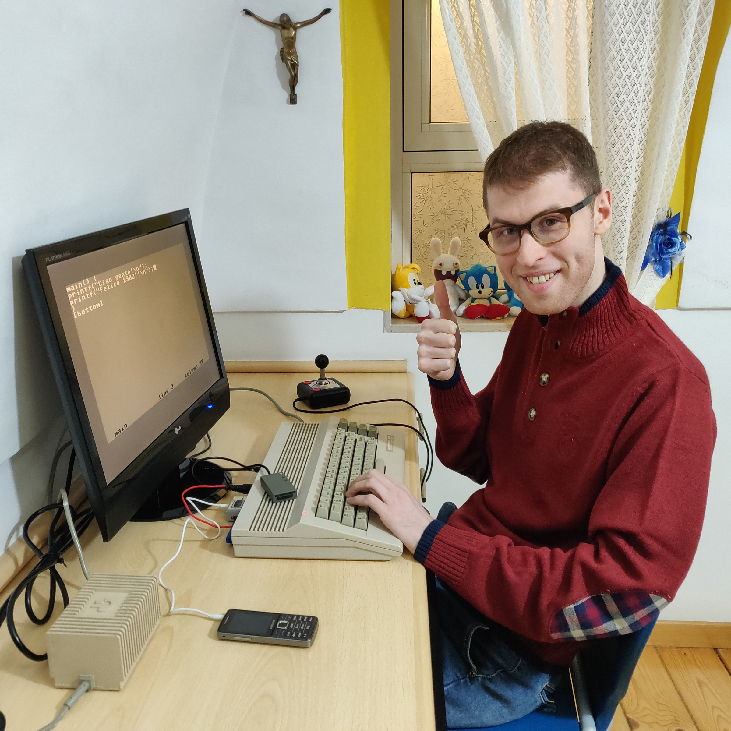 This photo was taken on January 2nd 2019; I’m before a Commodore 64C running Power C, through SD2IEC, a 1541 floppy drive emulator. There’s also a MP32C64, a Datasette emulator, attached to the computer.